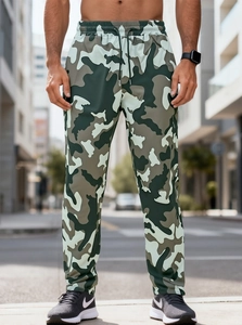 Detail of camouflage cargo pants featuring elastic drawstring waist and secure zipper pockets