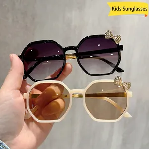 Children's hexagonal sunglasses with metal bow and rhinestone accent in two colors