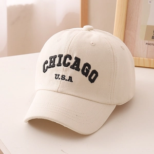 Detail of Chicago embroidery on a cream canvas baseball cap with retro sports style