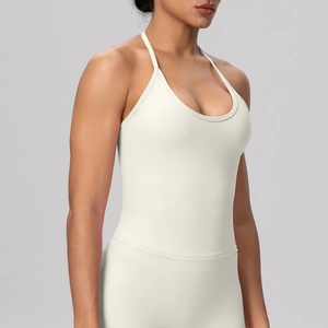 Detailed side view of the ivory backless yoga tank top showing elastic strap design