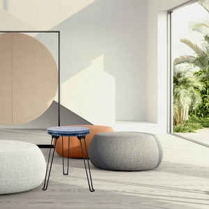 Detail of round side table with blue marble pattern top and black hairpin legs