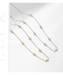 Detailed view of silver and gold flower petal chain necklaces in minimalist style