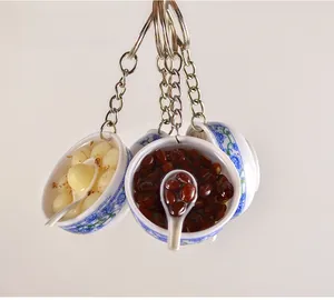 Miniature blue and white porcelain bowl pendants with realistic Chinese dessert food models