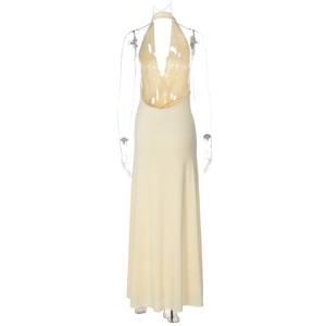 Detail view of the deep V-neckline and open back on a pale yellow floor-length dress
