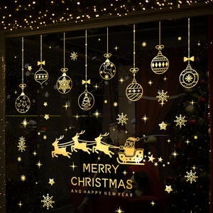 Golden Christmas window stickers with Santa sleigh, snowflakes and festive ornaments