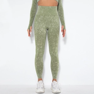 Detail of green acid wash seamless yoga leggings with high-waist ribbed compression band