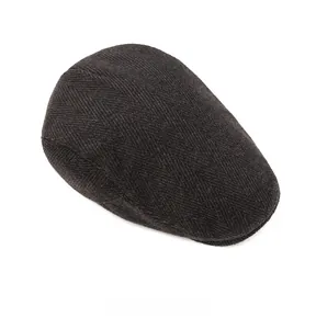 Top view of dark grey herringbone newsboy cap showing thick wool texture and flat top