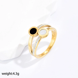 Detail view of double-layer gold ring with black and white inlay and pave-set zircons