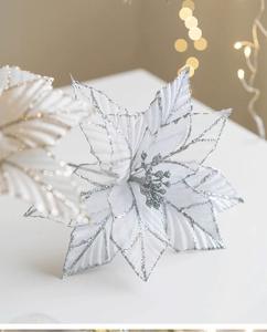 Close-up of silver velvet mesh Christmas poinsettia flower with glitter edges