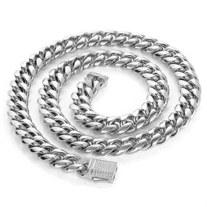 Macro detail of silver Cuban chain necklace with sparkling zircon encrusted clasp