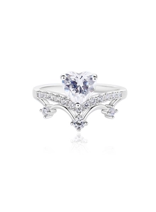 Macro detail of crown ring featuring heart-shaped central moissanite and pave setting