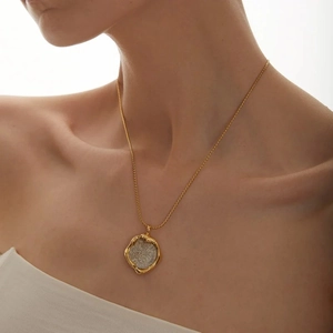Vintage style 18k gold plated brass necklace featuring a lucky coin pendant on model