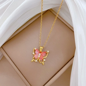 Elegant gold titanium steel necklace featuring a pink hollow butterfly pendant with crystals