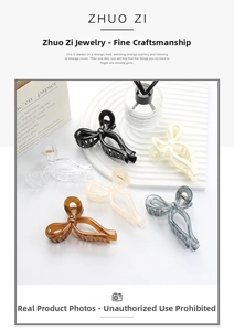 Close-up of elegant bow-shaped hair claws in six assorted colors on a white tray