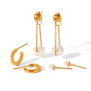 Macro view of 18k gold plated earring set featuring pearl drop chains and small studs