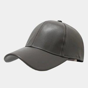 Detail shot of the dark grey PU leather texture and stitching on the baseball cap