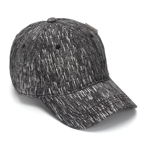 Detail shot of the six-panel baseball cap showing black and white snowy texture fabric