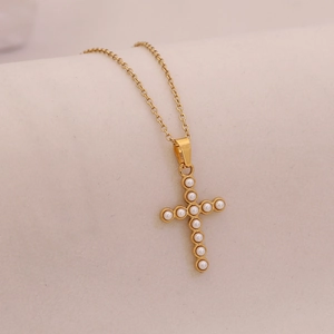 Elegant gold stainless steel necklace featuring a cross pendant with faux pearl accents
