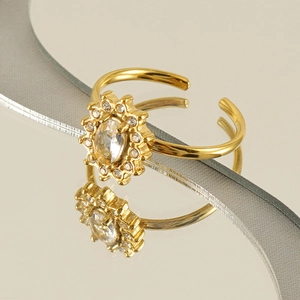 Detailed view of a gold sunflower ring featuring a central diamond with a polished finish