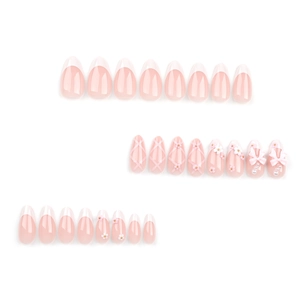 Pink and white French press-on nails with 3D bows, pearls, and delicate flower designs