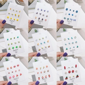 Macro display of colorful acetate and acrylic earring sets in flower and heart shapes