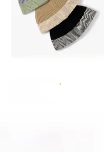 Detailed view of winter knitted beanie featuring a white herringbone pattern on the brim