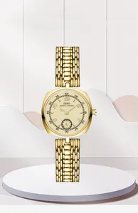 Close-up of a vintage square gold watch with small second dial and metal link bracelet