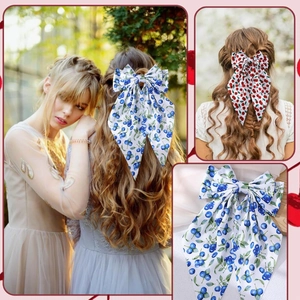 Double-layered bow hair clip with cherry and blueberry print and long fabric streamers