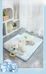 Blue cooling pet bed with cloud pattern and integrated pillow for small dogs or cats