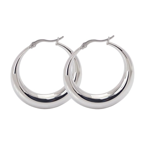 Close-up of high-polished silver crescent hoop earrings showing the secure clasp detail