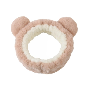 Close-up of soft plush bear ear headband in pink and white dual-tone design