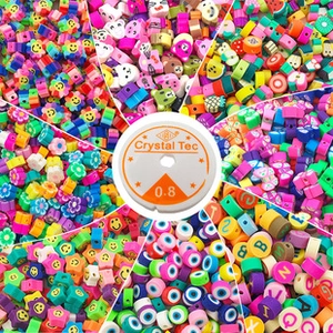 Macro shot of assorted DIY bead kit with polymer clay fruits, stars, and elastic string