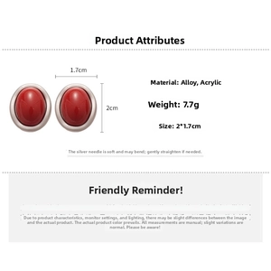 Detail view of red acrylic oval earrings with silver needle, size 2.0cm by 1.7cm