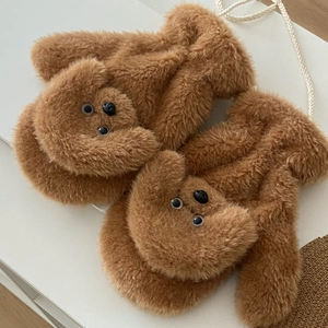 Detail of plush brown teddy dog mittens with neck strap and soft thermal fleece lining