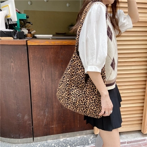 Close-up of leopard print canvas tote bag featuring large capacity and stylish texture