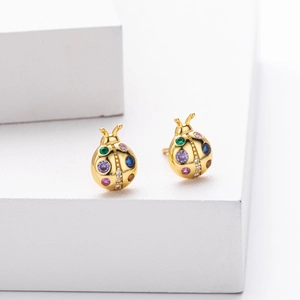 Creative 925 sterling silver ladybug earrings with colorful gemstones on a white base
