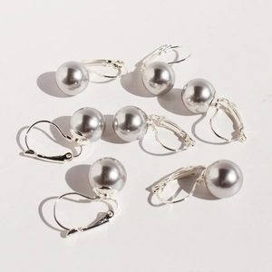 Elegant U-shaped silver-grey pearl earrings with classic French wire hooks on white