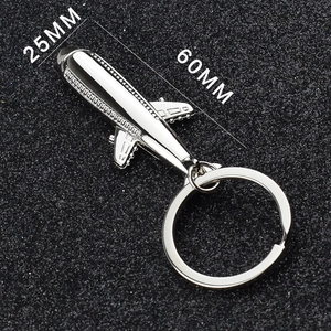 Detailed top view of silver metal fighter jet keychain measuring 60MM by 25MM