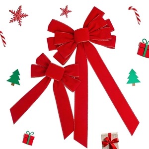Set of red flocked Christmas bows with silver edges on a white festive background