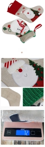 Macro detail of the rustic linen fabric and knit texture on the Christmas stocking