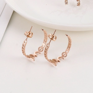 Minimalist C-shaped rose gold hoop earrings with LOVE hollow lettering design