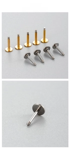 Macro shot of titanium steel flat back labret studs in gold and silver screw-in design