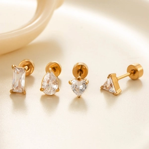 Set of four gold stainless steel stud earrings with heart, teardrop, square and triangle zircons