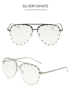 Detail view of aviator silver metal frame sunglasses with decorative metal rivets