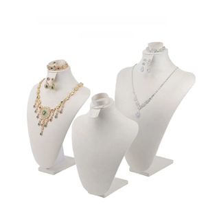 Macro view of beige velvet 4-in-1 jewelry display set for necklaces and earrings