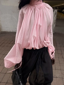 Pale pink high neck blouse with pleated details and oversized lantern sleeves in satin