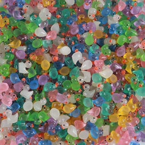 Macro shot of colorful luminous resin ducks for DIY crafts and micro landscape decoration