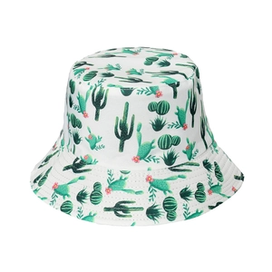 Close-up of the cotton sun hat featuring a vibrant green cactus and pink flower pattern