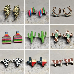 Collection of nine wooden western-style stud earrings with diverse desert-themed patterns