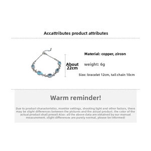Detail view of aquamarine zircon bow bracelet showing 12cm length and 10cm tail chain